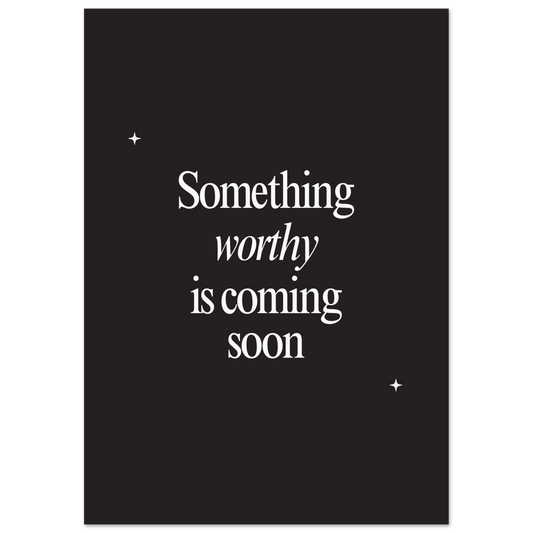 Black background inspirational poster with serif white text reading “Something worthy is coming soon,” designed with minimalist star accents.