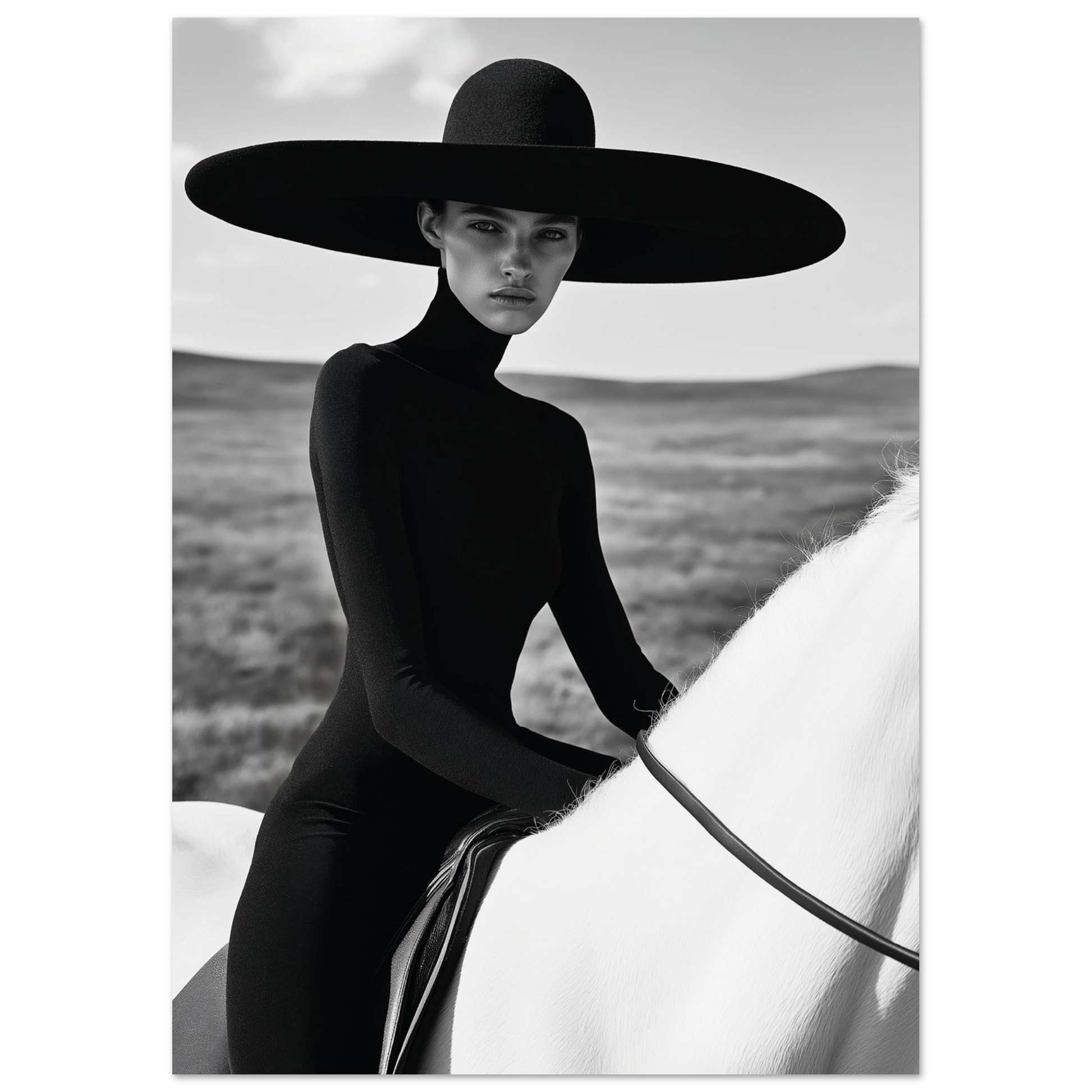 Striking black and white portrait of a woman in a black dress and wide hat seated on a white horse in an open landscape, exuding minimalist fashion elegance.