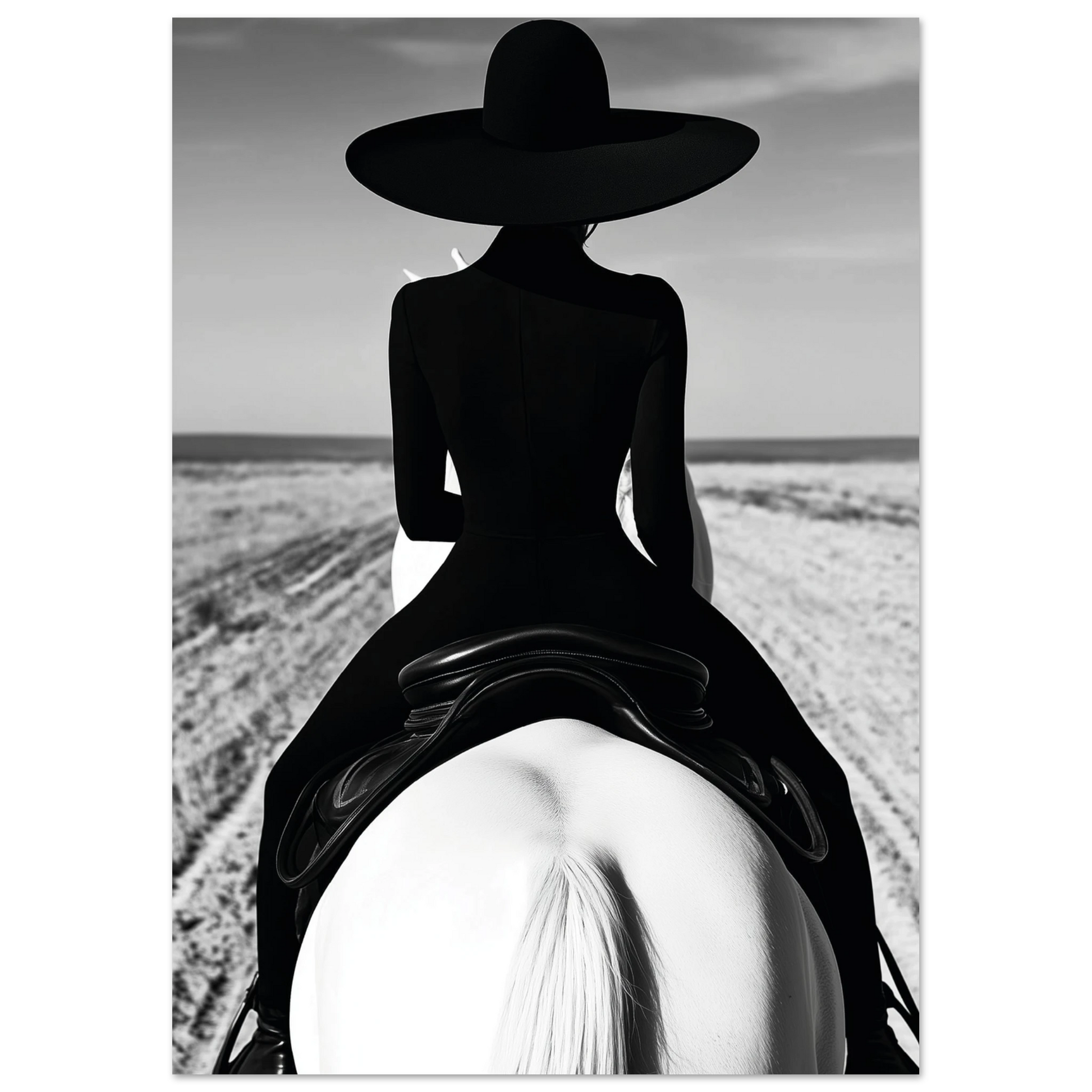 Black and white art print showing a woman in a sleek black dress and wide-brimmed hat riding a white horse along a sandy beach trail, photographed from behind.